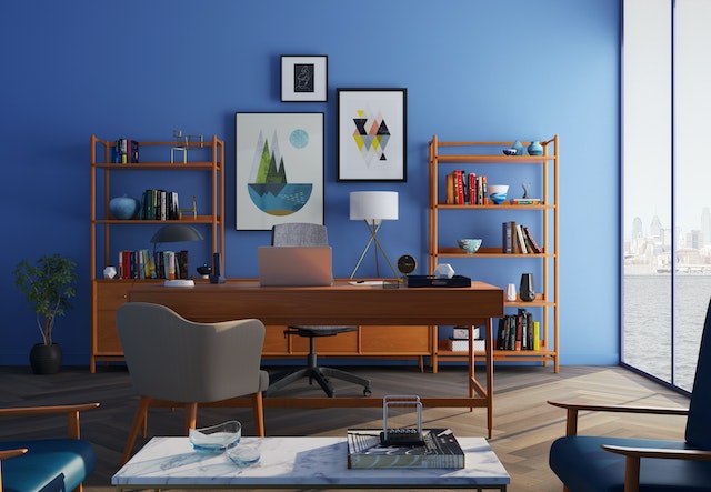 a well maintained study with a blue wall